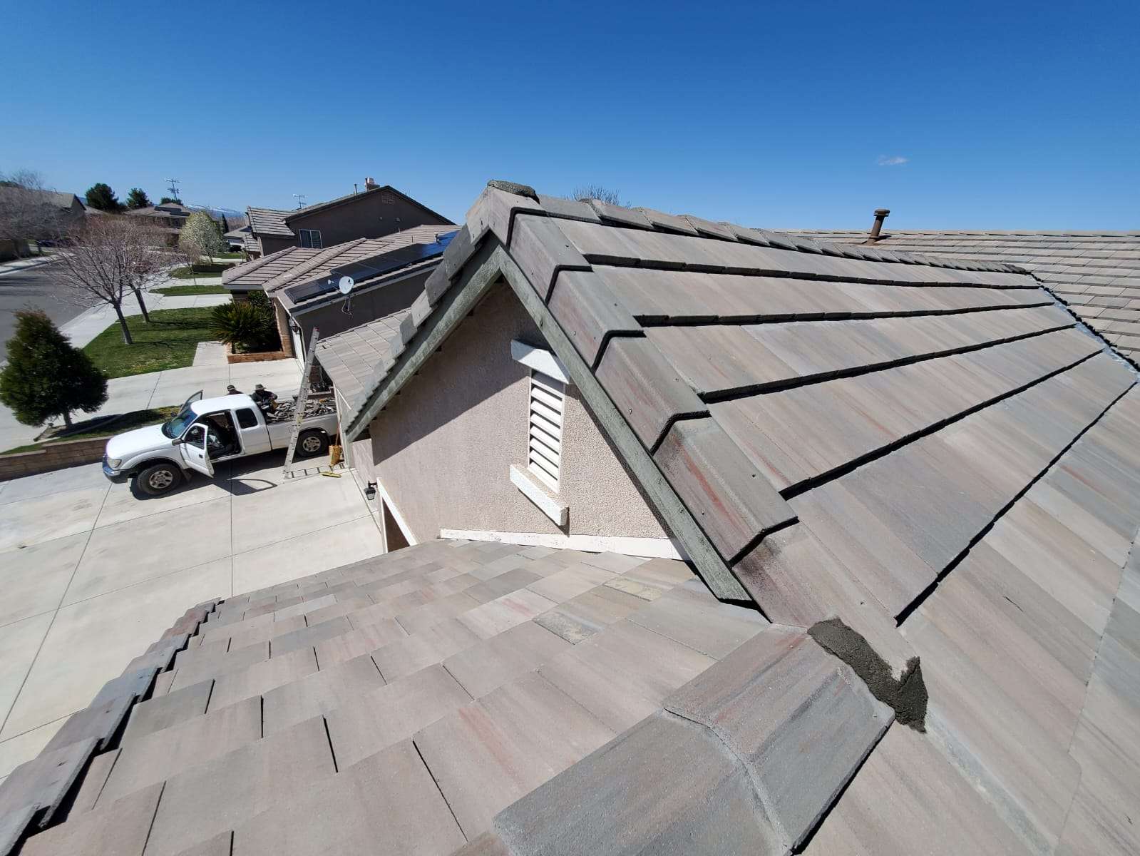 Tile roof removal and reinstallation with new underlayment by Coronado Roof Care in Santa Clarita, CA, License #1127354.