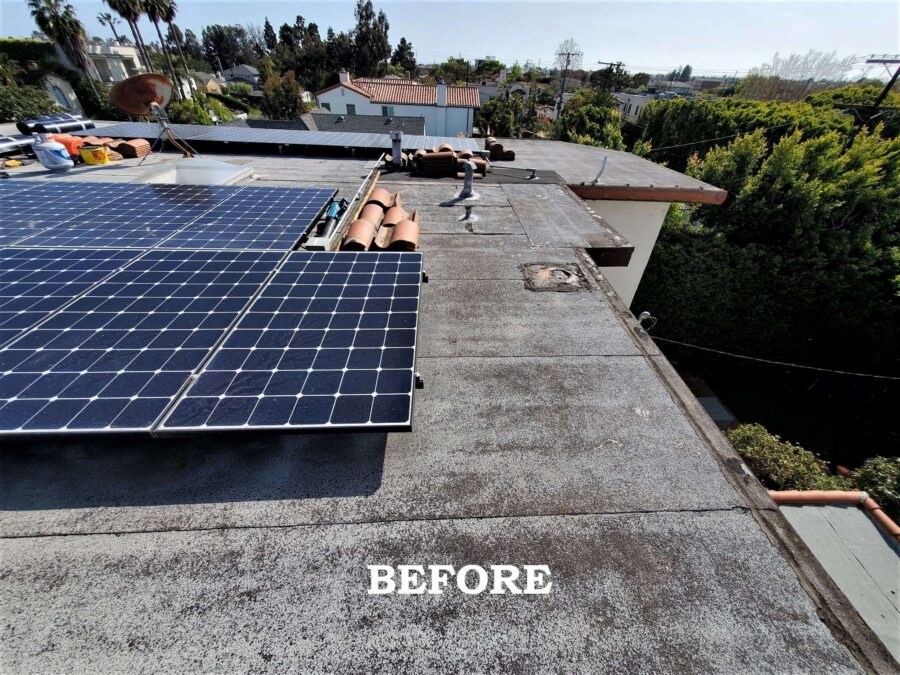 Before second-layer modified bitumen installation in Los Angeles—worn flat roof surface and unsealed pipe flashings prior to repair