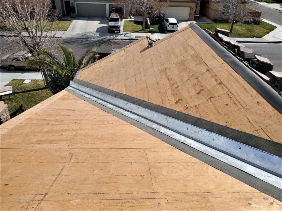 Roof in Lancaster, CA after tile removal and before underlayment—prep stage for tile reinstallation and Tesla solar panel integration