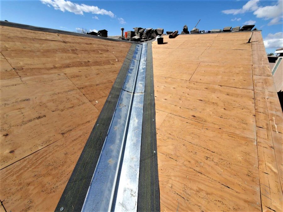 Roof in Lancaster, CA after tile removal and before underlayment—prep stage for tile reinstallation and Tesla solar panel integration