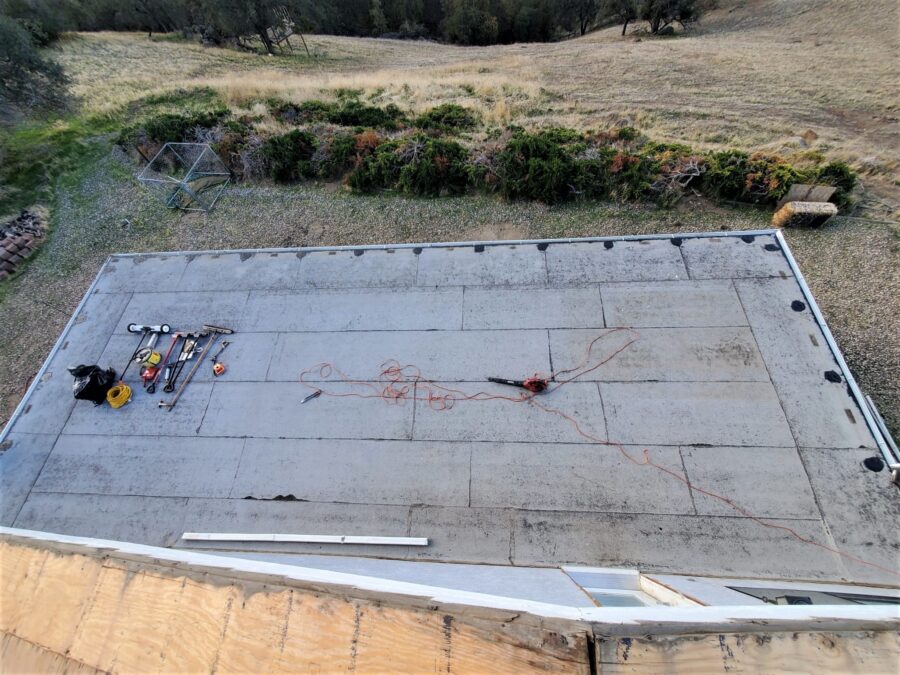 Second-story balcony in Tehachapi before second-layer modified bitumen installation—worn surface awaiting upgraded waterproofing