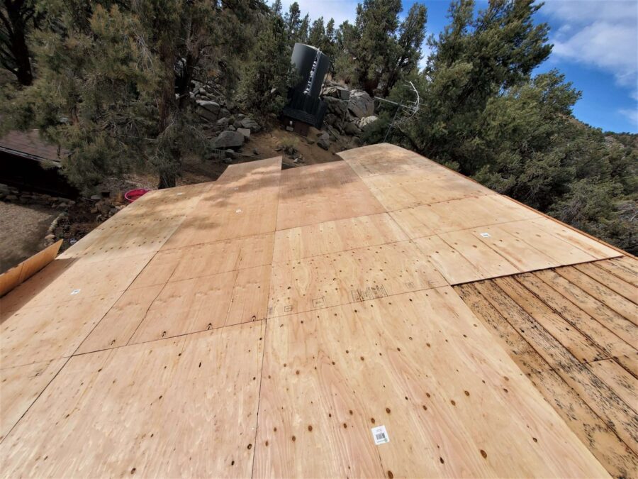 New plywood sheathing installed during roof replacement in Kennedy Meadows, CA—solid decking prep for Malarkey Willow Wood shingles