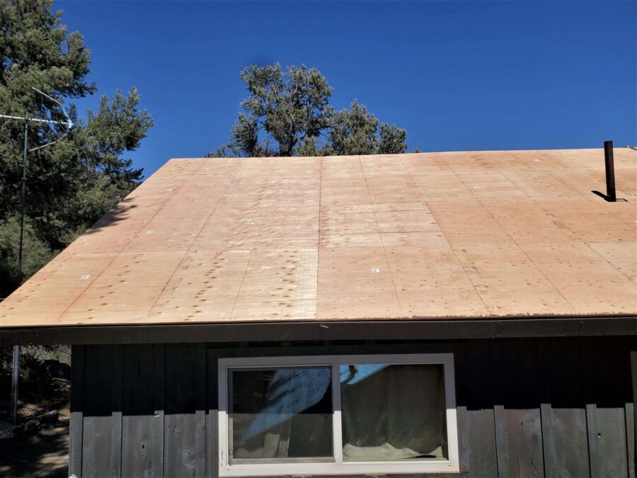 New plywood sheathing installed during roof replacement in Kennedy Meadows, CA—solid decking prep for Malarkey Willow Wood shingles