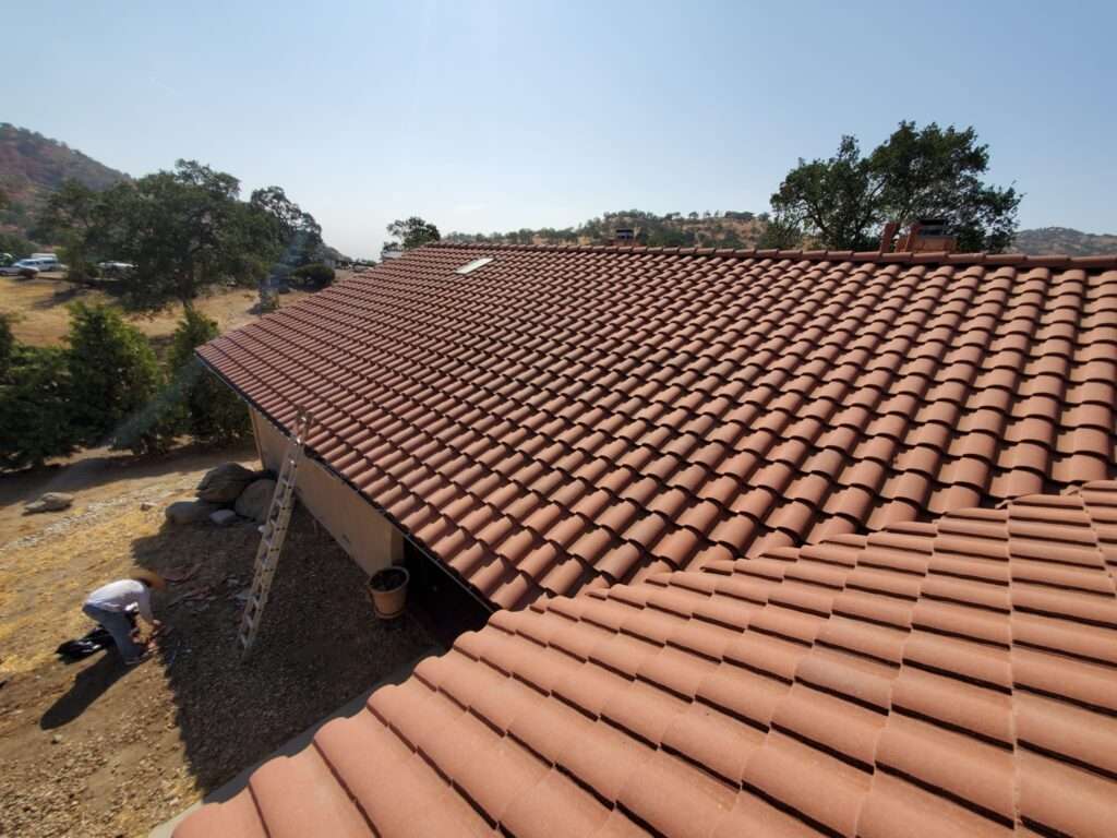 Partial terracotta tile roof installation and aesthetic tile swap in Tehachapi, CA—expert roof repair with regional style in mind