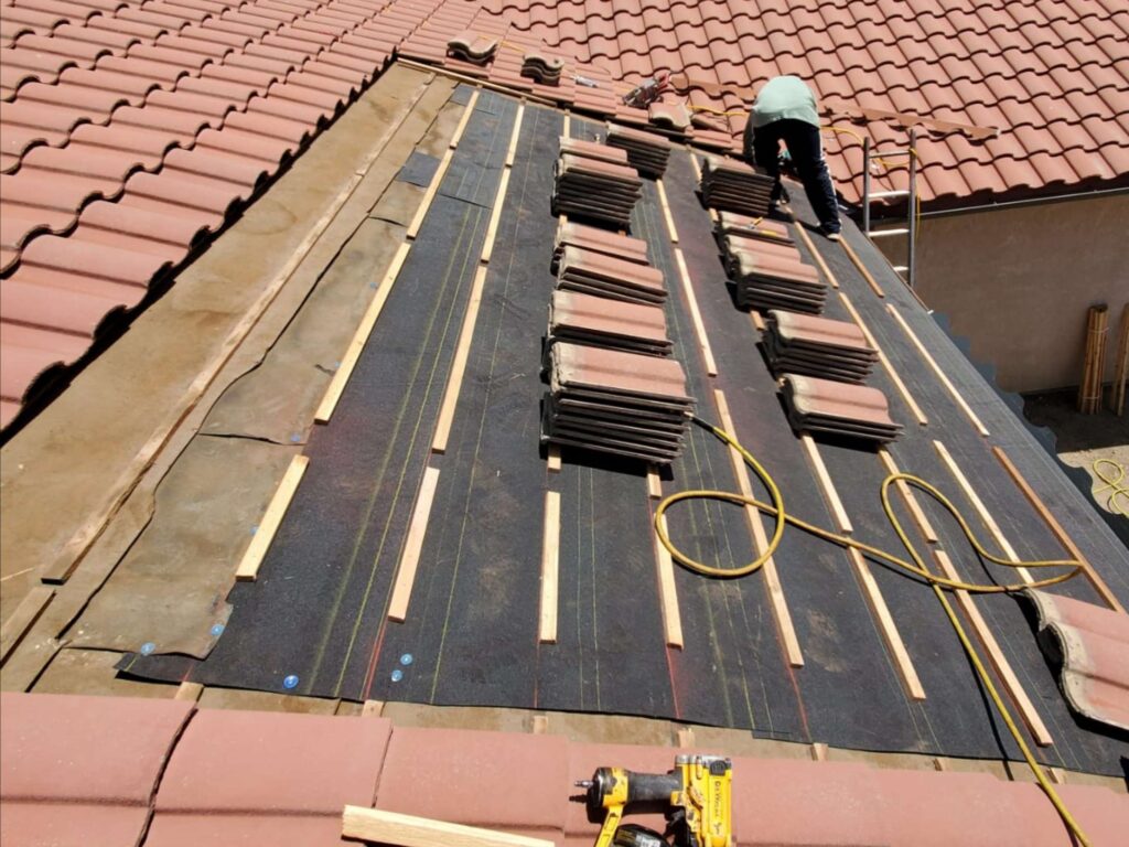Partial terracotta tile roof installation and aesthetic tile swap in Tehachapi, CA—expert roof repair with regional style in mind