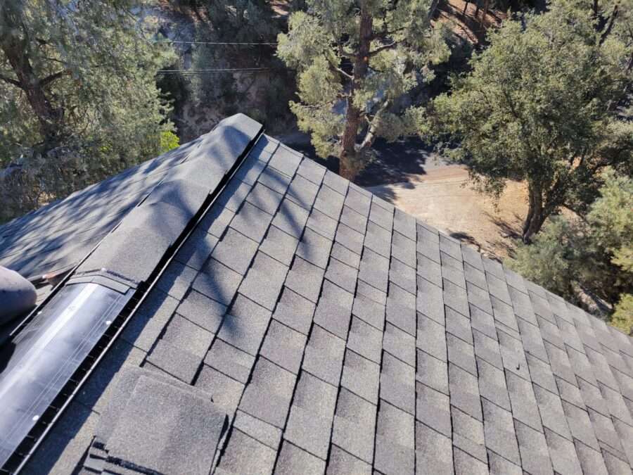 Completed GAF Timberline shingle roof with new flashings and GAF Cobra ridge vents installed in Pine Mountain Club, CA—roof replacement complete